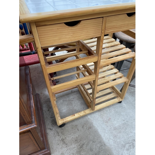 1957 - A MODERN PINE KITCHEN ISLAND ON CASTORS WITH WINE RACK AND TILED TOP