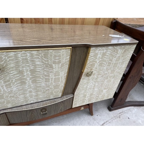 1965 - A RETRO CREAMY WALNUT EFFECT SIDEBOARD/COCTAIL CABINET, ENCLOSING FOUR CUPBOARDDS AND TWO DRAWERS, 6... 