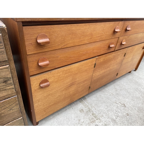 1977 - A RETRO STAG TEAK SIDEBOARD ENCLOSING FOUR DRAWERS AND CUPBOARDS, 60