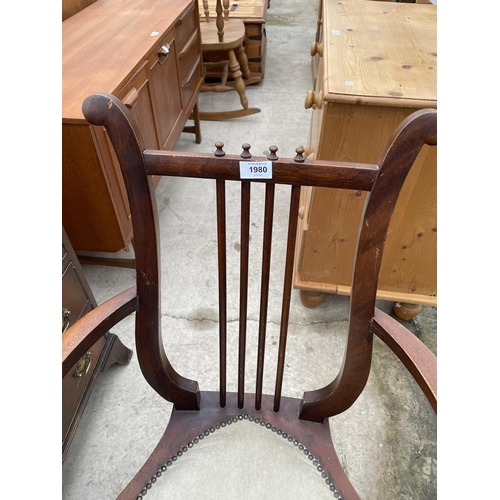 1980 - AN EDWARDIAN MAHOGANY ELBOW CHAIR WITH HEART SHAPED SEAT AND HARP STYLE BACK