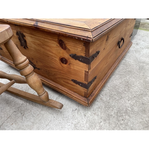 1984 - A MEXICAN PINE STORAGE CHEST WITH METEAL STRAPS