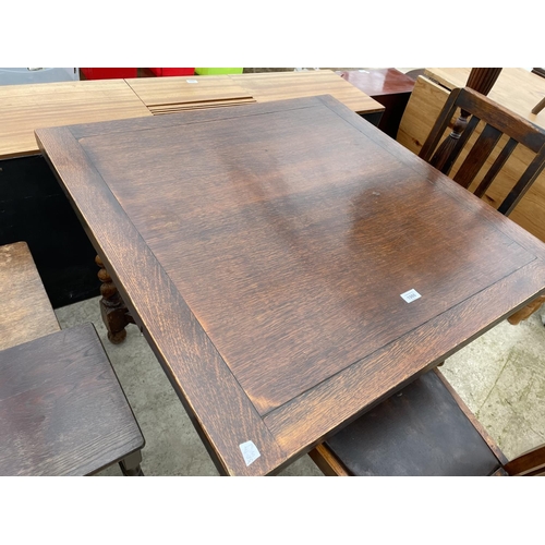 1986 - AN OAK DRAW-LEAF TABLE AND TWO CHAIRS