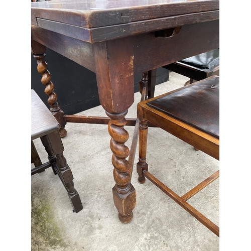 1986 - AN OAK DRAW-LEAF TABLE AND TWO CHAIRS