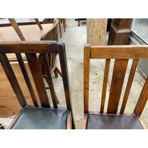 1986 - AN OAK DRAW-LEAF TABLE AND TWO CHAIRS