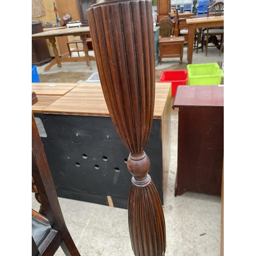 1987 - A MAHOGANY STANDARD LAMP ON TURNED AND FLUTED COLUMN COMPLETE WITH SHADE