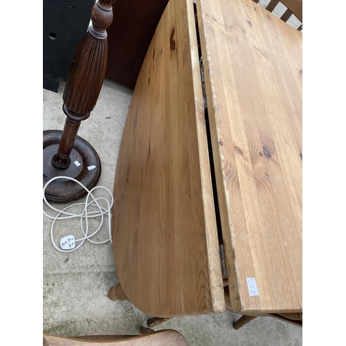 1988 - A PINE DROP-LEAF KITCHEN TABLE AND THREE CHAIRS