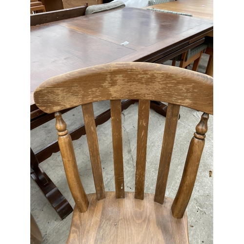 1988 - A PINE DROP-LEAF KITCHEN TABLE AND THREE CHAIRS