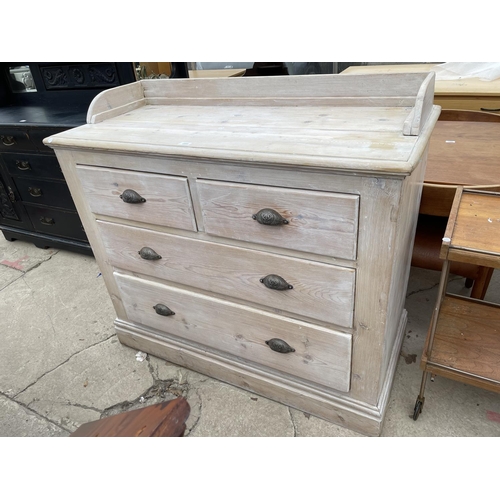 1995 - A VICTORIAN PINE GALLERY BACK CHEST OF TWO SHORT AND TWO LONG DRAWERS WITH LIMED FINISH