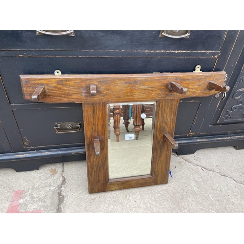 1996 - AN EARLY 20TH CENTURY OAK WALL MOUNTED MIRROR WITH FOUR COAT HOOKS, 49x44x22