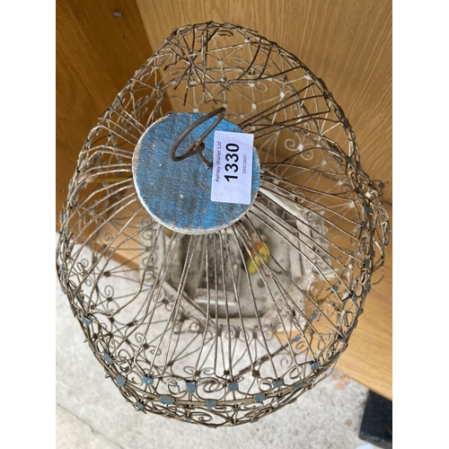 1330 - A VINTAGE AND ORNATE DECORATIVE BIRD CAGE