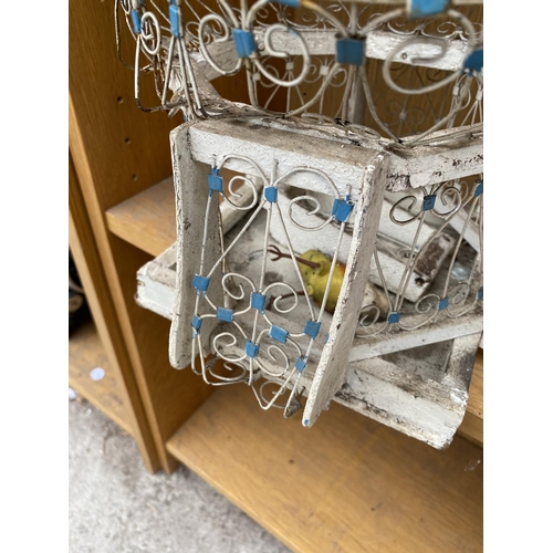 1330 - A VINTAGE AND ORNATE DECORATIVE BIRD CAGE