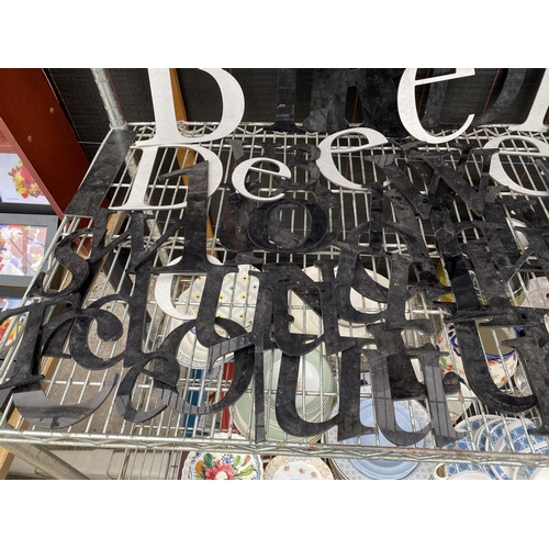 1340 - A LARGE ASSORTMENT OF BLACK AND SILVER PLASTIC SIGN MAKING LETTERS AND NUMBERS