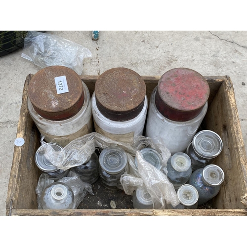 1372 - A VINTAGE WOODEN BOX CONTAINING GLASS STORAGE JARS AND SCIENTIFIC BOTTLES