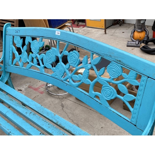 1384 - A BLUE GARDEN BENCH WITH CAST BENCH ENDS AND FLORAL DETAIL