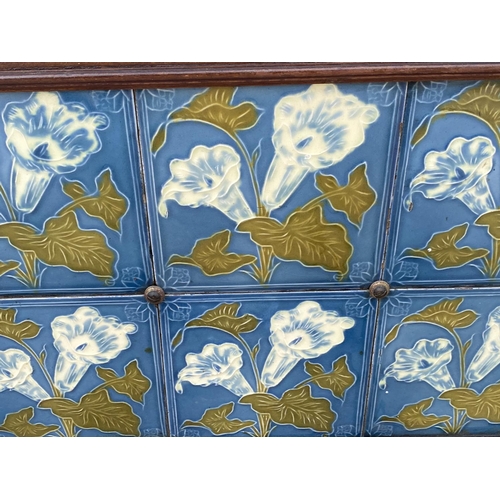 1428 - A VINTAGE DECORATIVE TILED BACK FROM A WASH STAND