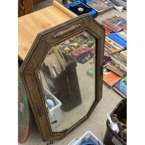 1440 - A WOODEN BED SIDE CABINET, A MIRROR AND A DECORATIVE CHARGER