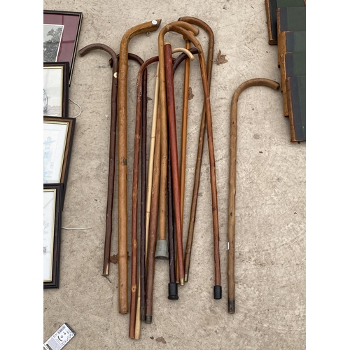 1453 - AN ASSORTMENT OF WOODEN WALKING STICKS