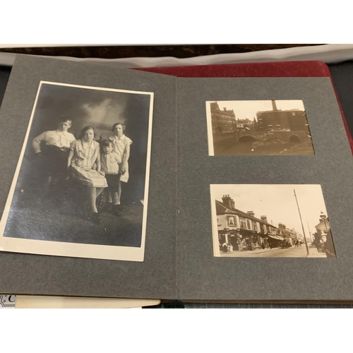 64 - A VINTAGE HARDBACK PHOTO ALBUM TO CONTAIN A SELECTION OF BLACK AND WHITE EXAMPLES