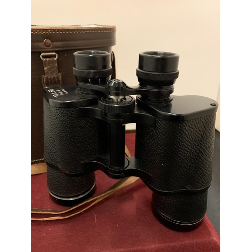 67 - A PAIR OF LEATHER CASED 10X50 FIELD BINOCULARS