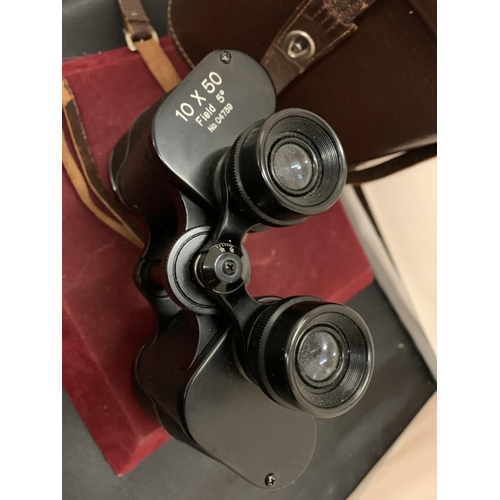 67 - A PAIR OF LEATHER CASED 10X50 FIELD BINOCULARS