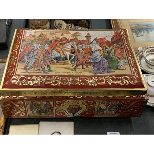 71 - A LARGE ORNATE METAL GERMAN BISCUIT TIN - HEIGHT 16CMS WIDTH 42CMS