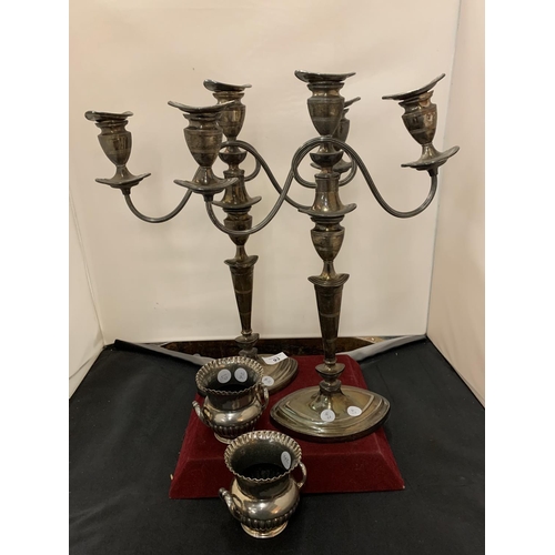 93 - A PAIR OF SILVER PLATED THREE BRANCH CANDELABRAS AND A PAIR OF SMALL URN SHAPED VASES