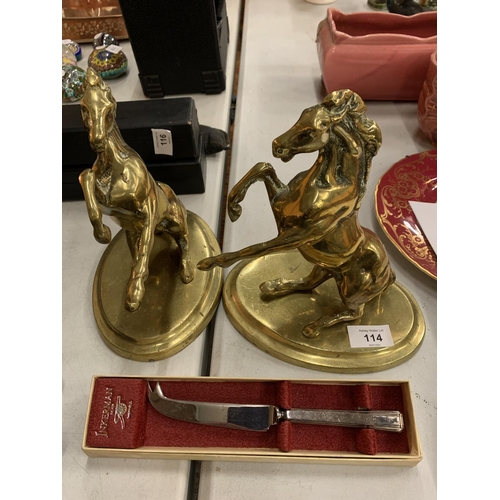 114 - A PAIR OF BRASS REARING HORSES ON PLINTHS AND A INKERMAN SHEFFIELD CHEESE KNIFE