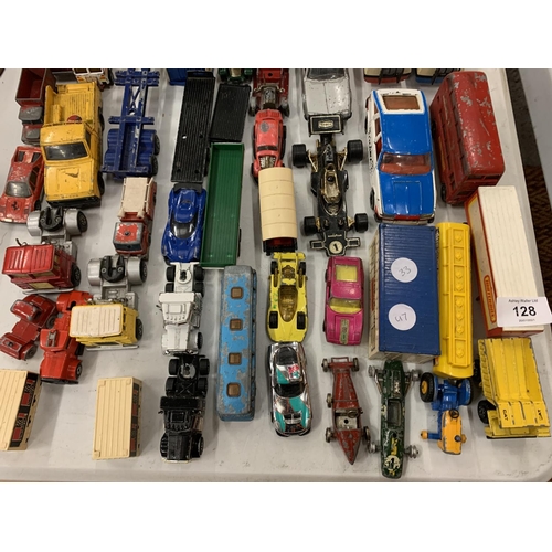 128 - A LARGE QUANTITY OF DIE CAST VEHICLES TO INCLUDE A LONDON BUS, TRAILERS ETC