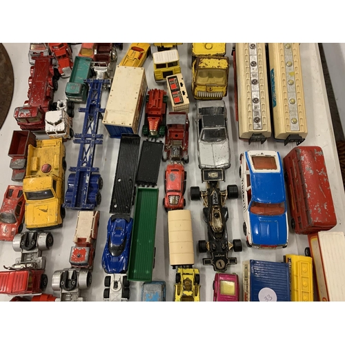 128 - A LARGE QUANTITY OF DIE CAST VEHICLES TO INCLUDE A LONDON BUS, TRAILERS ETC