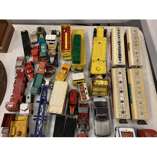 128 - A LARGE QUANTITY OF DIE CAST VEHICLES TO INCLUDE A LONDON BUS, TRAILERS ETC