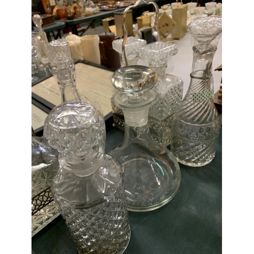 150 - A LARGE COLLECTION OF VARIOUS GLASS DECANTERS TO INCLUDE TWO STANDS AND TWO SPIRIT LABELS