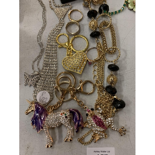 157 - A COLLECTION OF ASSORTED COSTUME JEWELLERY TO INCLUDE NECKLACES, DRESS RINGS, KEYRINGS ETC