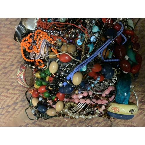 176 - A LARGE CLEAR CONTAINER OF MIXED COSTUME JEWELLERY TO INCLUDE NECKLACES, BANGLES ETC