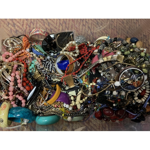 176 - A LARGE CLEAR CONTAINER OF MIXED COSTUME JEWELLERY TO INCLUDE NECKLACES, BANGLES ETC