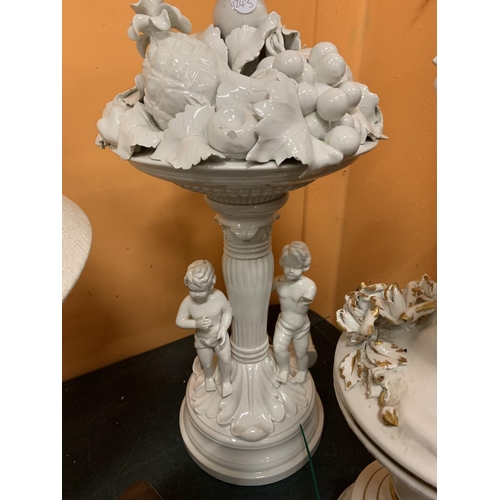 180 - A PAIR OF DECORATIVE WHITE CHINA TABLE LAMPS FEATURING CHERUBS AND FRUIT