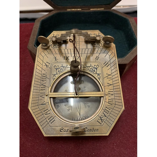 22 - A BOXED BRASS SUNDIAL COMPASS 'COX OF LONDON'