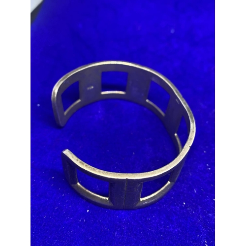 638 - TWO HEAVY SILVER BRACELETS MARKED 925 TO INCLUDE A BANGLE AND A CELTIC STYLE