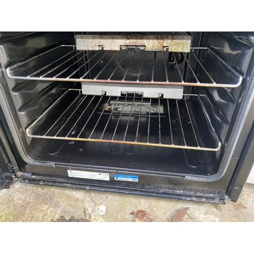 1802 - A SILVER BEKO GAS AND ELECTRIC FREESTANDING OVEN AND HOB BELIEVED WORKING OIRDER BUT NOI WARRANTY