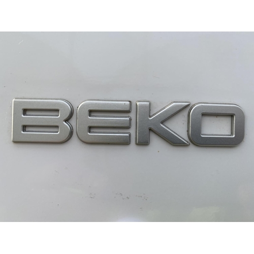 1816 - A WHITE BEKO UPRIGHT FRIDGE FREEZER WITH WATER DISPENSER BELIEVED IN WORKING ORDER BUT NO WARRANTY