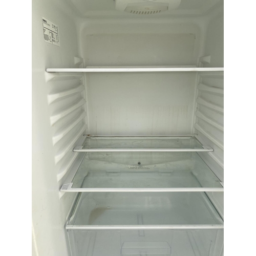 1816 - A WHITE BEKO UPRIGHT FRIDGE FREEZER WITH WATER DISPENSER BELIEVED IN WORKING ORDER BUT NO WARRANTY