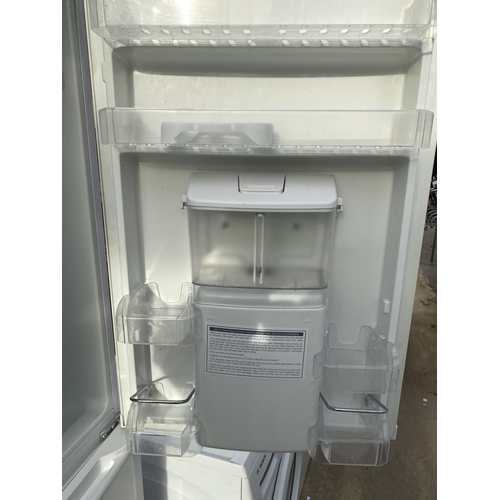 1816 - A WHITE BEKO UPRIGHT FRIDGE FREEZER WITH WATER DISPENSER BELIEVED IN WORKING ORDER BUT NO WARRANTY