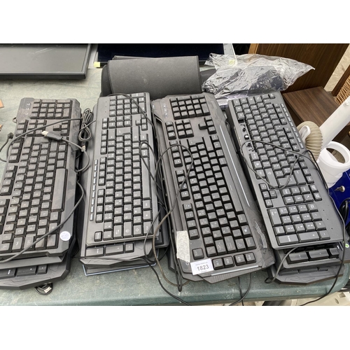 1823 - A QUANTITY OF COMPUTER KEYBOARDS AND MOUSE MATS