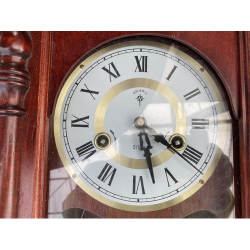 1460 - A DECORATIVE WOODEN WALL CLOCK WITH MECHANISM