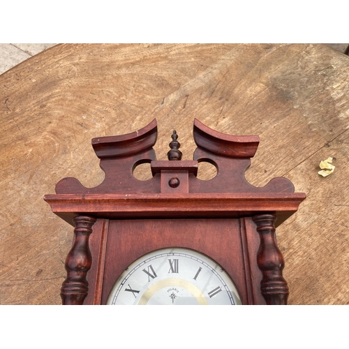 1460 - A DECORATIVE WOODEN WALL CLOCK WITH MECHANISM