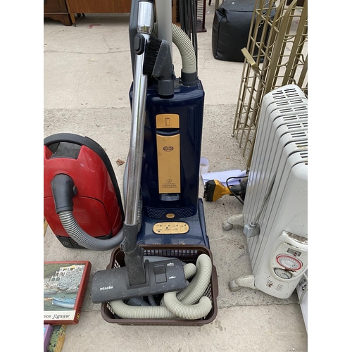 1486 - A SEBO VACUUM AND A FURTHER MIELE HOOVER