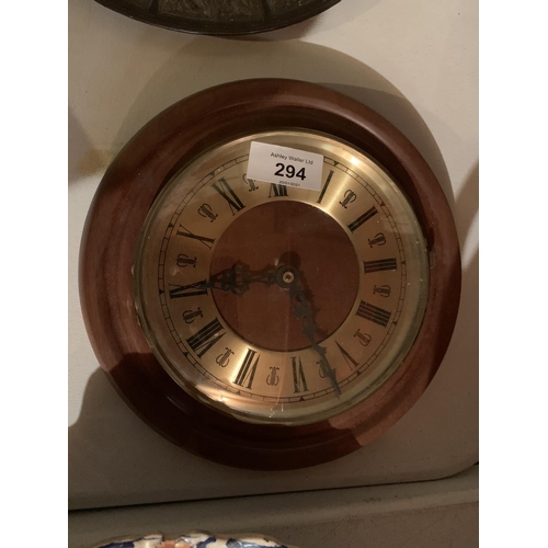 294 - A COPPER KETTLE, EMBOSSED METAL CHARGER AND A WALL CLOCK