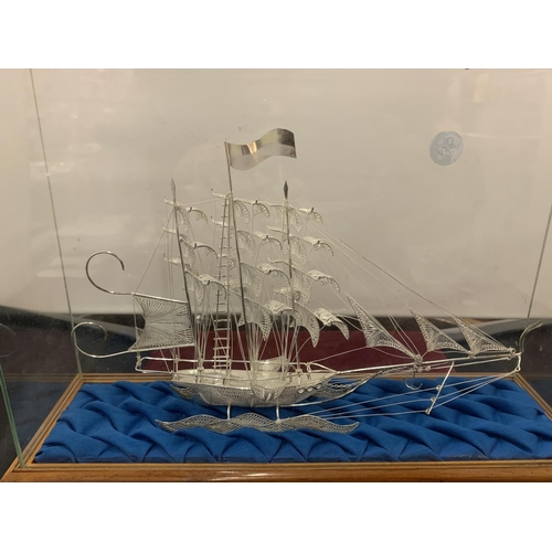 839 - A MODEL OF A GALLEON IN A DISPLAY CASE