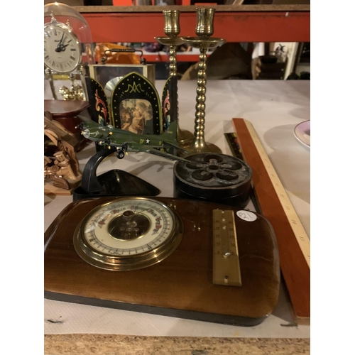 988 - AN ECLECTIC ASSORTMENT OF ITEMS TO INCLUDE RELIGIOUS ITEMS, TWO CLOCKS, BRASS CANDLESTICKS ETC