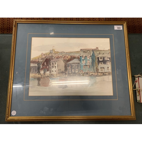 995 - A FRAMED WATERCOLOUR OF A HARBOUR FRONT AND SURROUNDINGS SIGNED MARGARET PARKER 1984