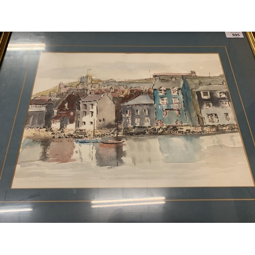 995 - A FRAMED WATERCOLOUR OF A HARBOUR FRONT AND SURROUNDINGS SIGNED MARGARET PARKER 1984